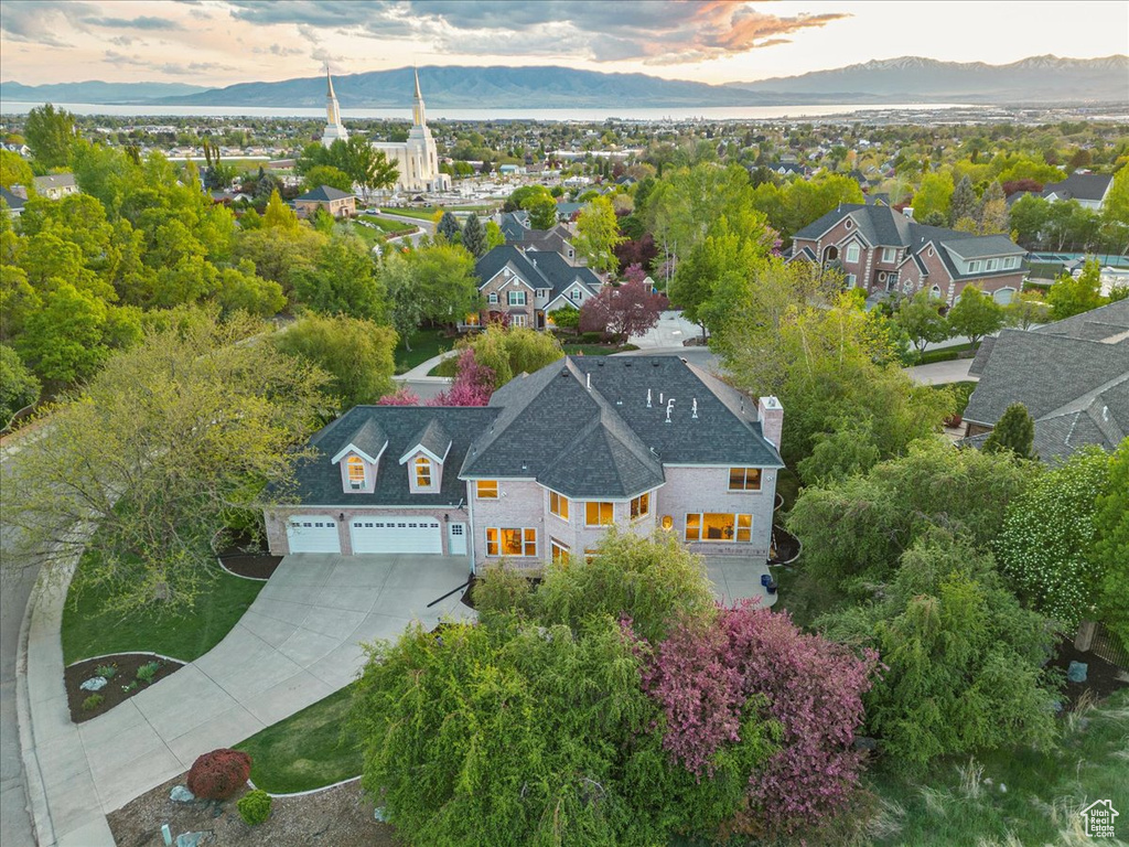 Aerial view at dusk featuring a residential view and a mountain view