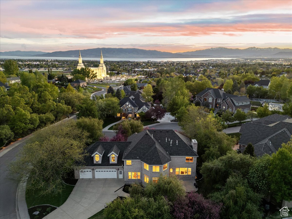 Aerial view at dusk featuring a mountain view