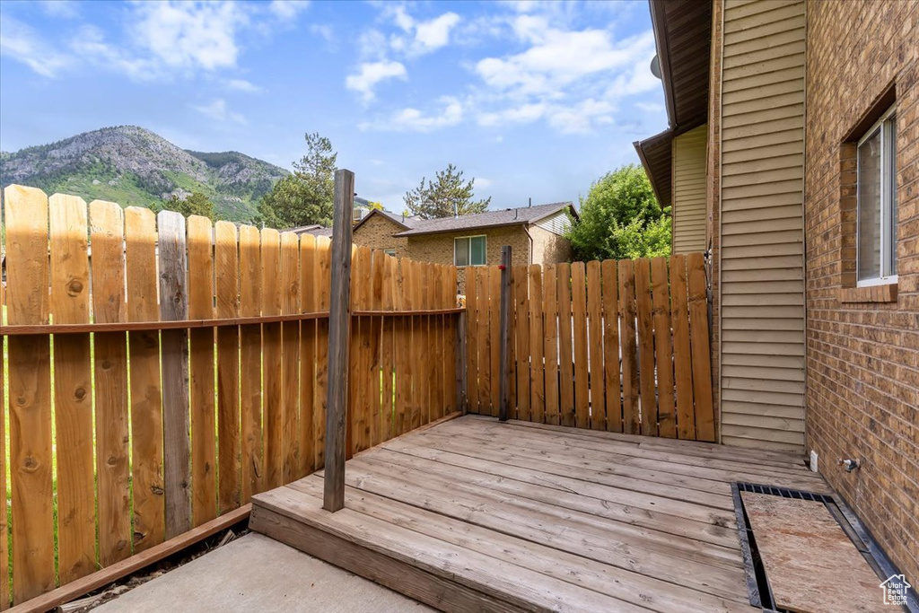 Wooden terrace featuring a mountain view