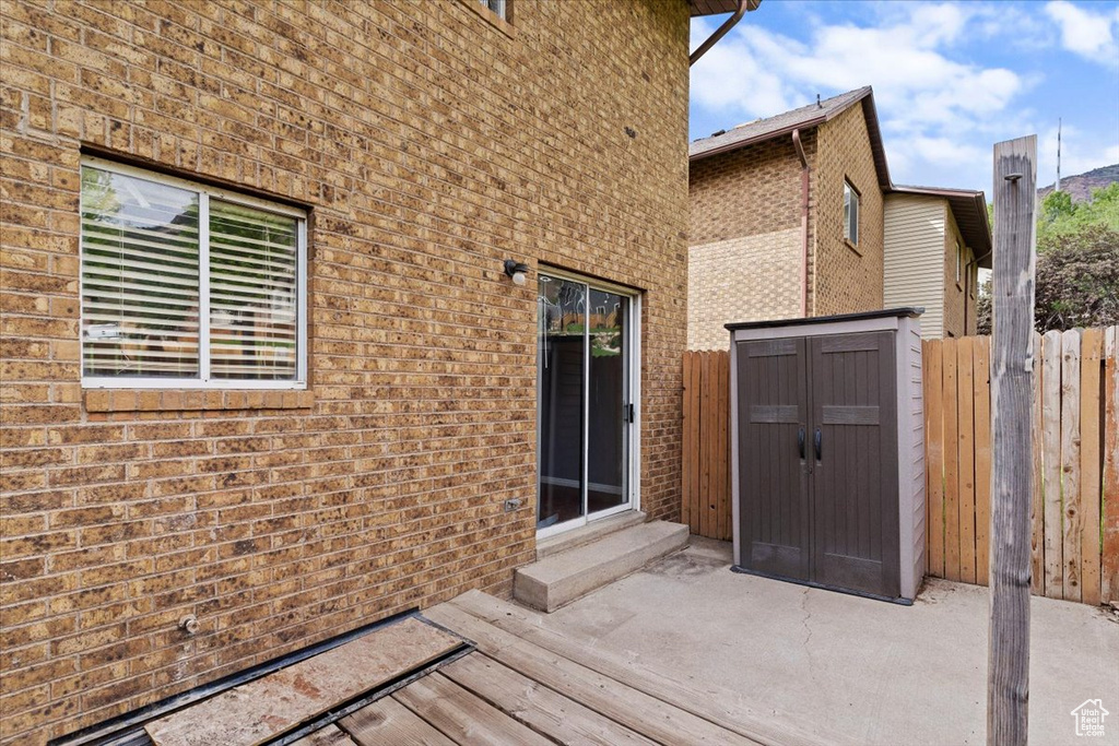 Deck with entry steps and a patio