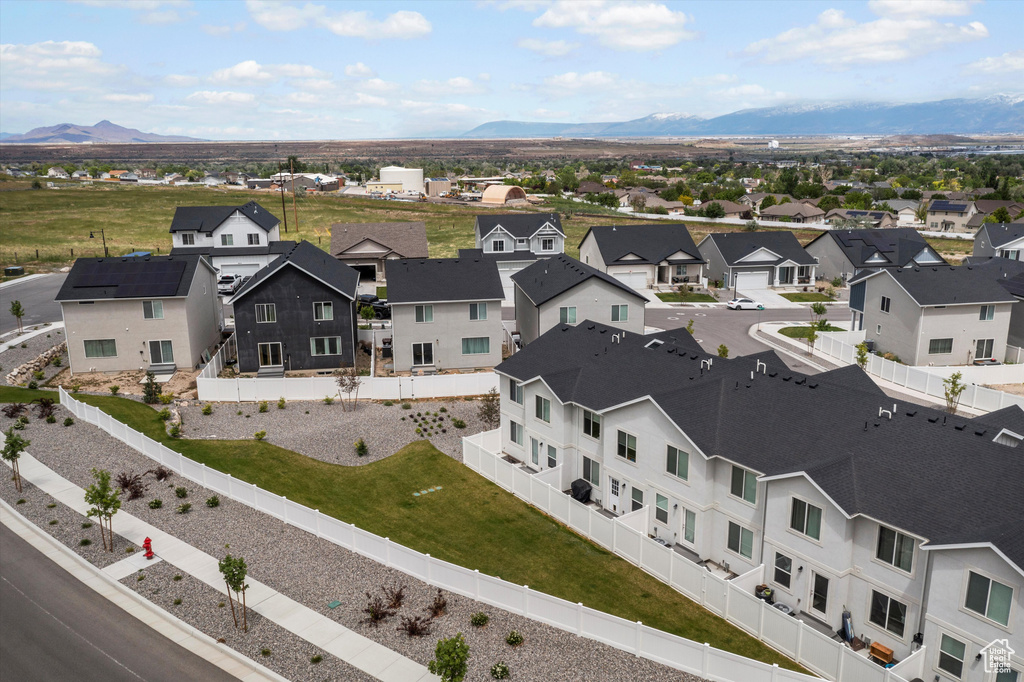 Aerial view of residential area with a mountainous background