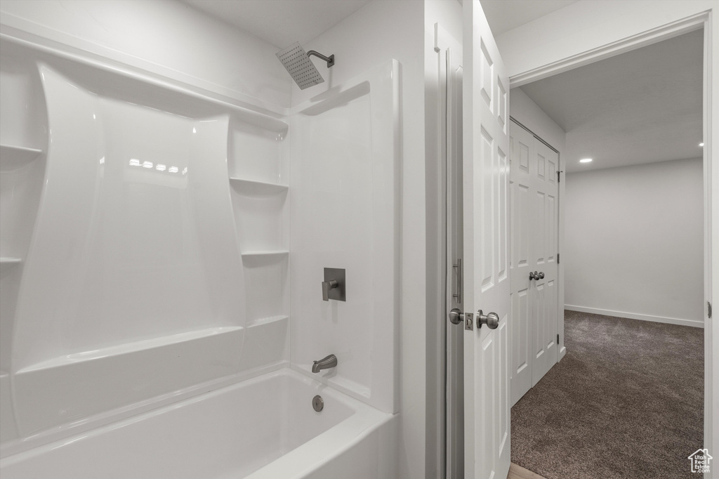 Full bathroom featuring shower / bath combination, recessed lighting, and baseboards