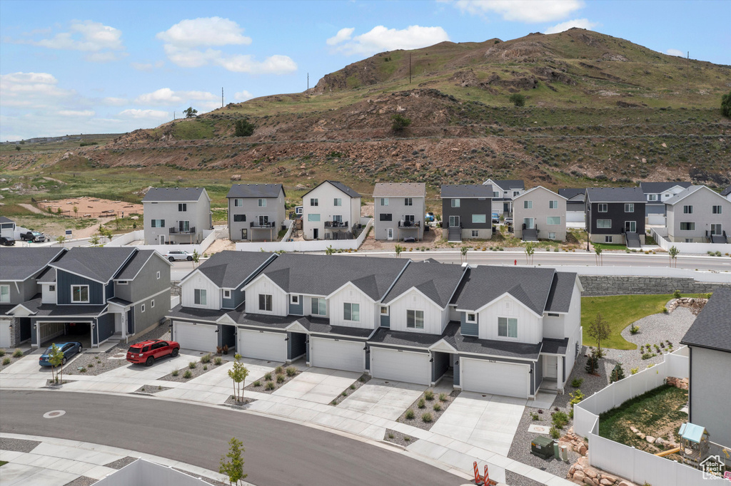 Aerial perspective of suburban area with a mountain backdrop