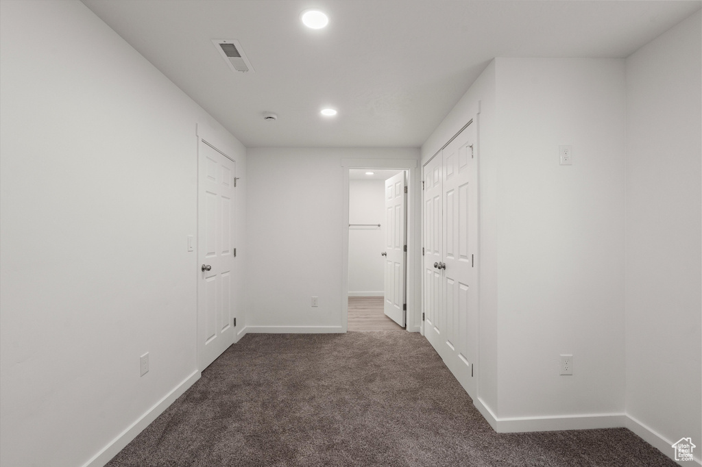 Unfurnished bedroom with carpet floors, recessed lighting, and baseboards