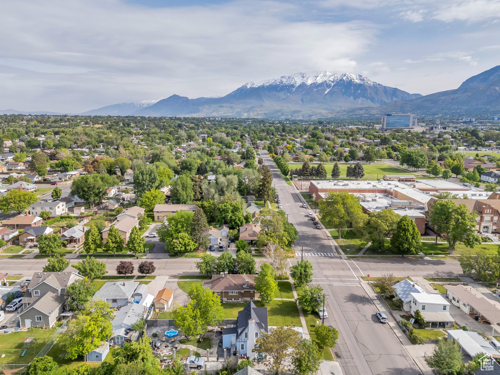 Aerial view of residential area featuring a mountainous background