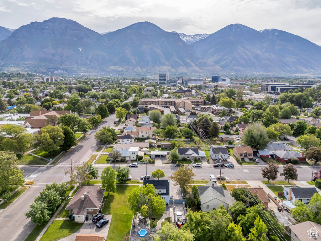 Aerial perspective of suburban area featuring a mountain backdrop