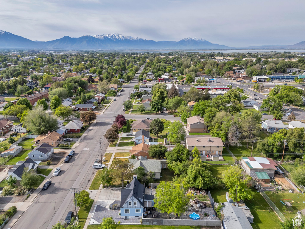 Aerial perspective of suburban area with a mountainous background