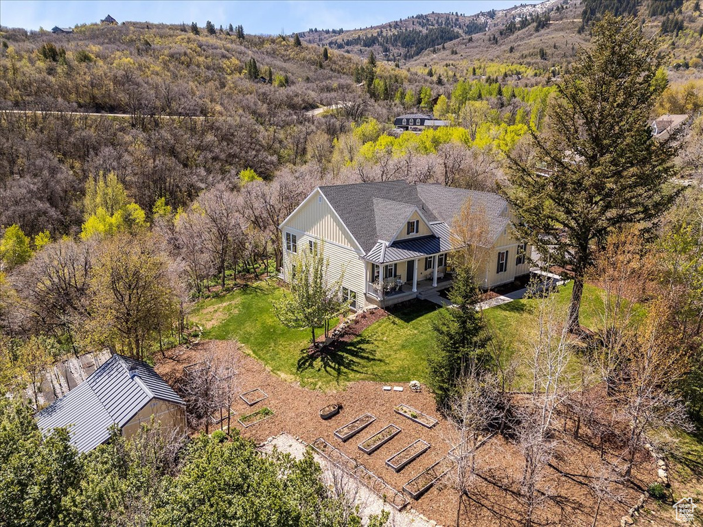 View from above of property with a heavily wooded area