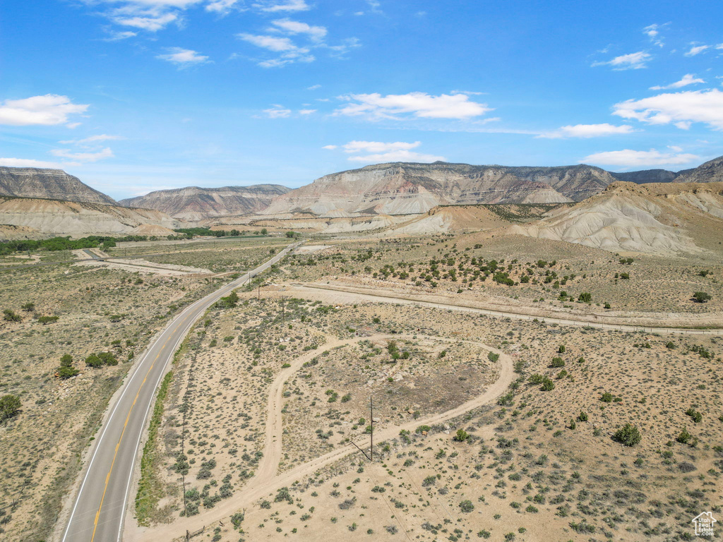 View of mountain backdrop with rural landscape and a desert landscape