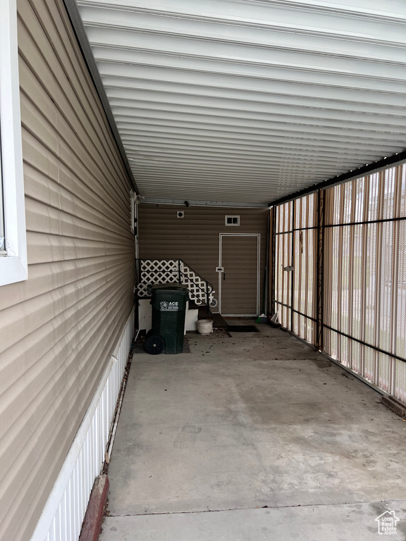 Garage featuring a carport