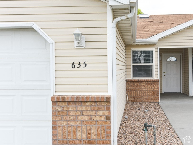 Property entrance with an attached garage