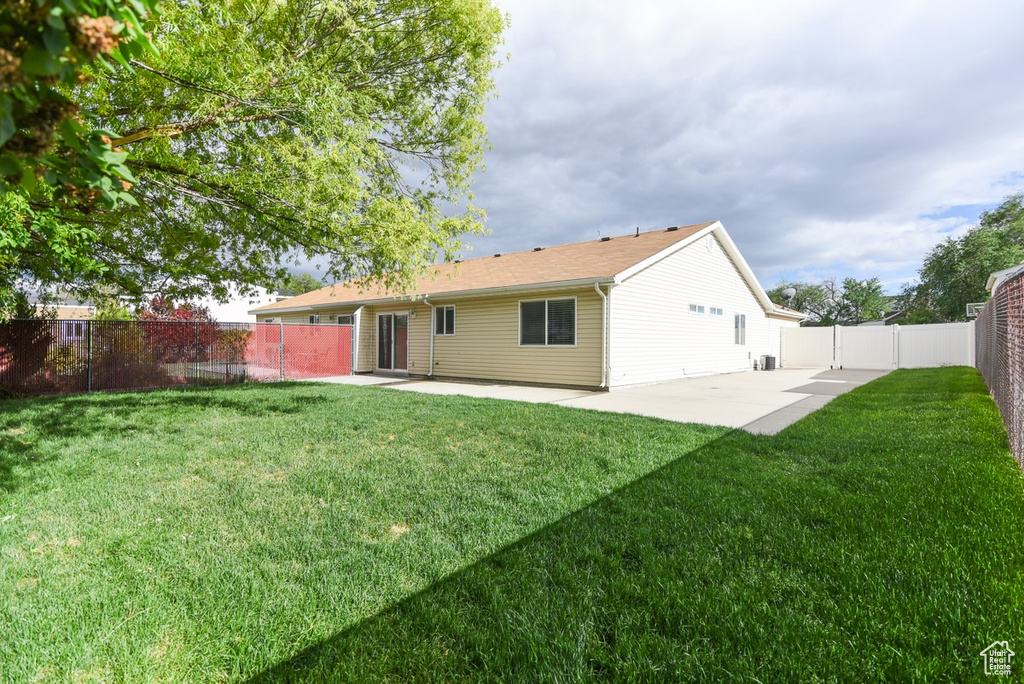 Rear view of house with a patio area
