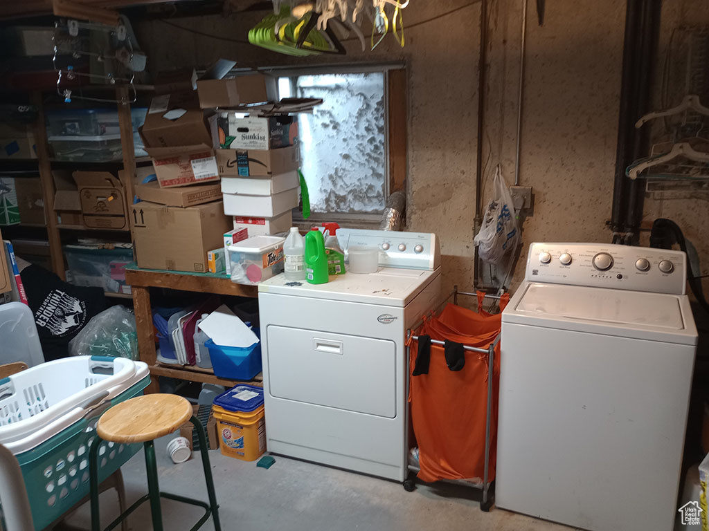 Laundry room with washer and clothes dryer
