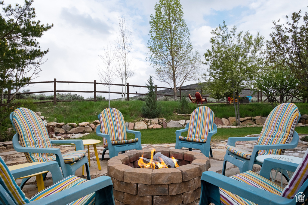 View of patio / terrace with an outdoor fire pit