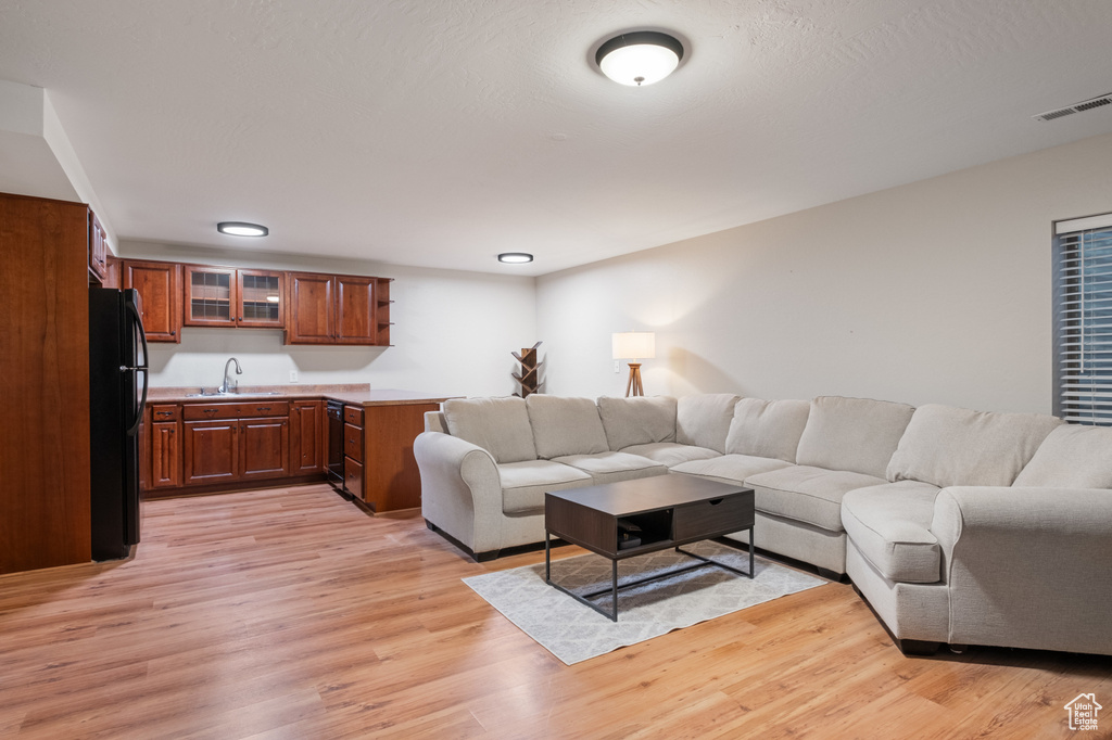 Living area featuring light wood-style flooring