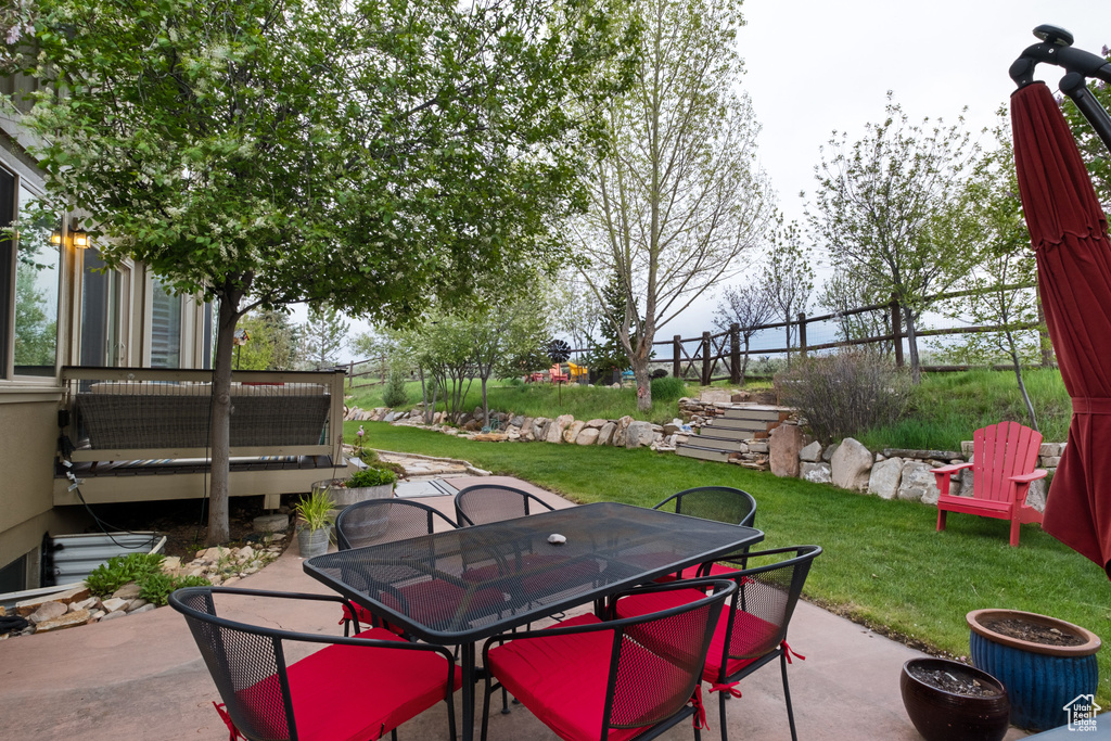 View of patio with outdoor dining area
