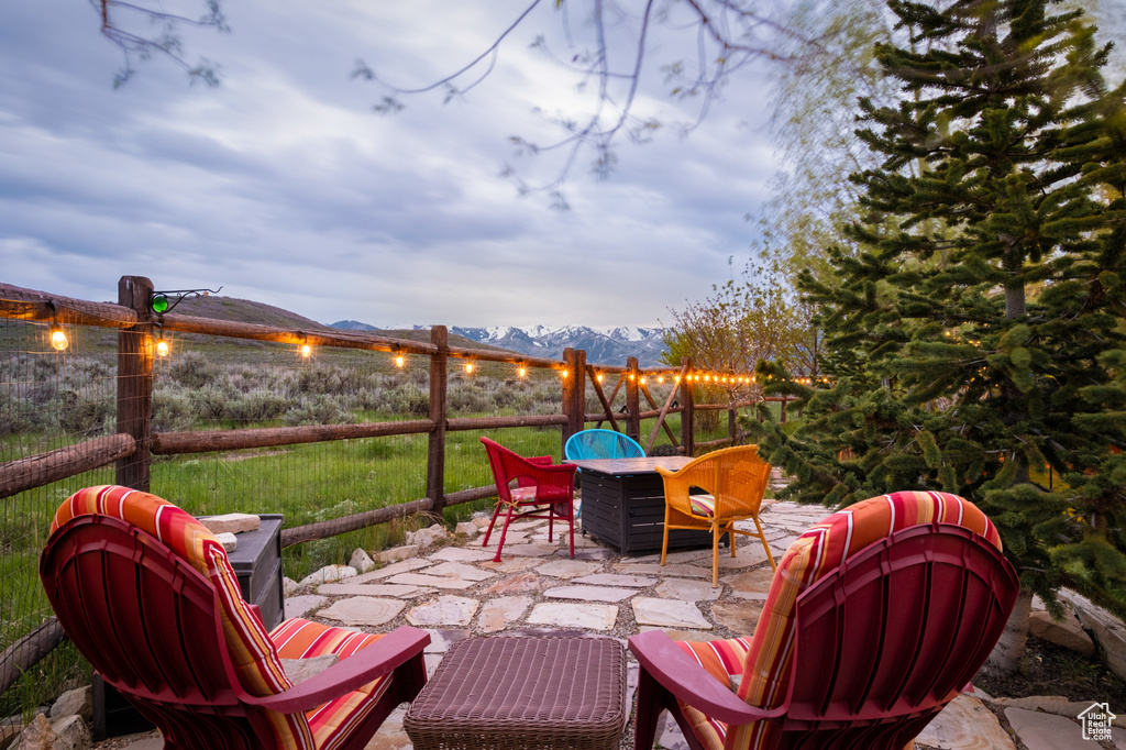 View of patio / terrace featuring outdoor dining space and a mountain view