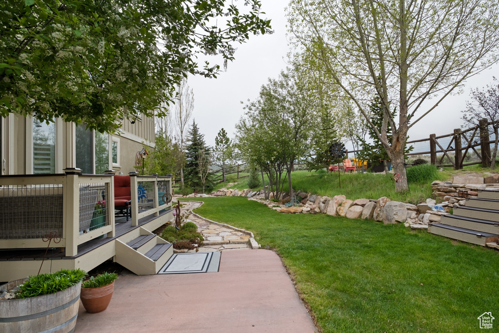 View of yard featuring a deck and a cooling unit