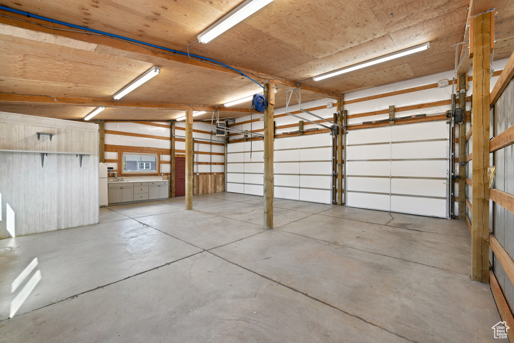 Garage with freestanding refrigerator
