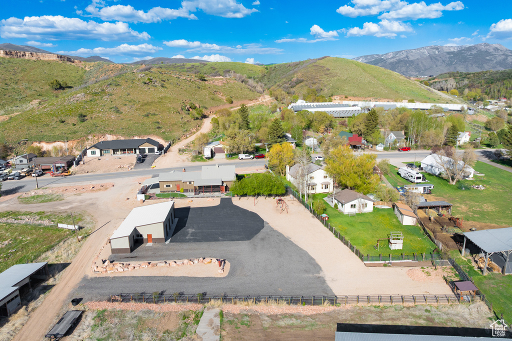 Aerial perspective of suburban area with a mountain backdrop
