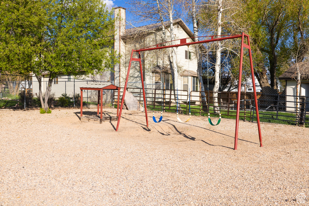 View of jungle gym with fence