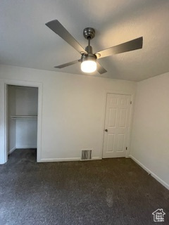 Unfurnished bedroom with baseboards, carpet floors, and ceiling fan