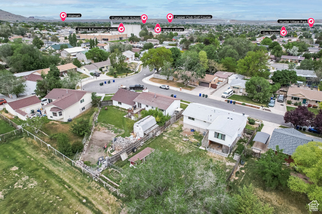 Aerial view of property's location with nearby suburban area
