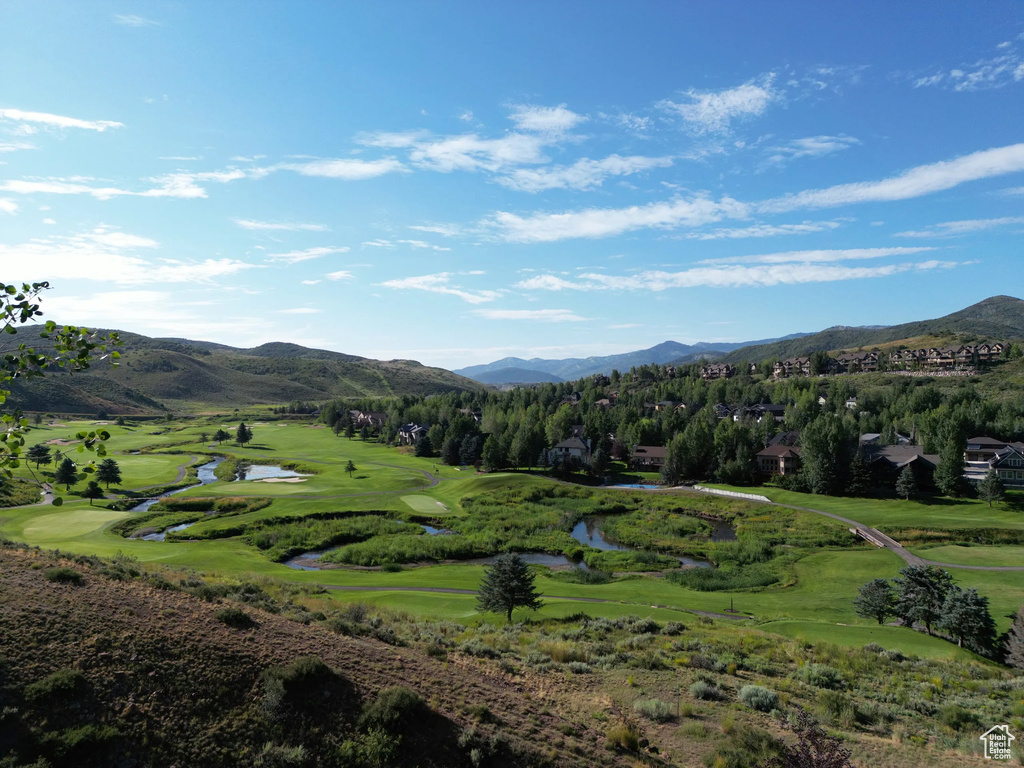Mountain view with a nearby body of water and a golf club