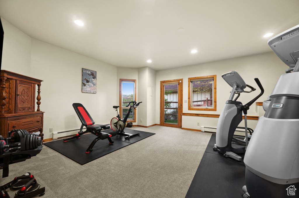 Workout area with recessed lighting, a baseboard heating unit, baseboards, and carpet floors