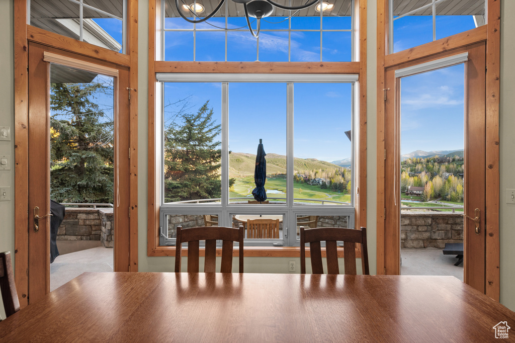 Dining area with a mountain view and healthy amount of natural light