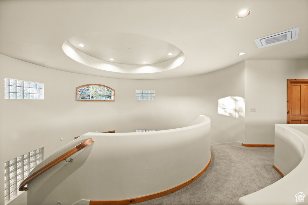Hall with recessed lighting, carpet flooring, and baseboards