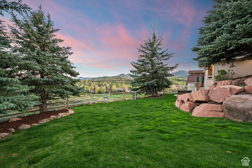 Yard at dusk with a mountain view