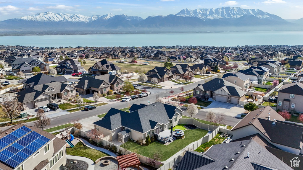 Aerial perspective of suburban area with a water and mountain view