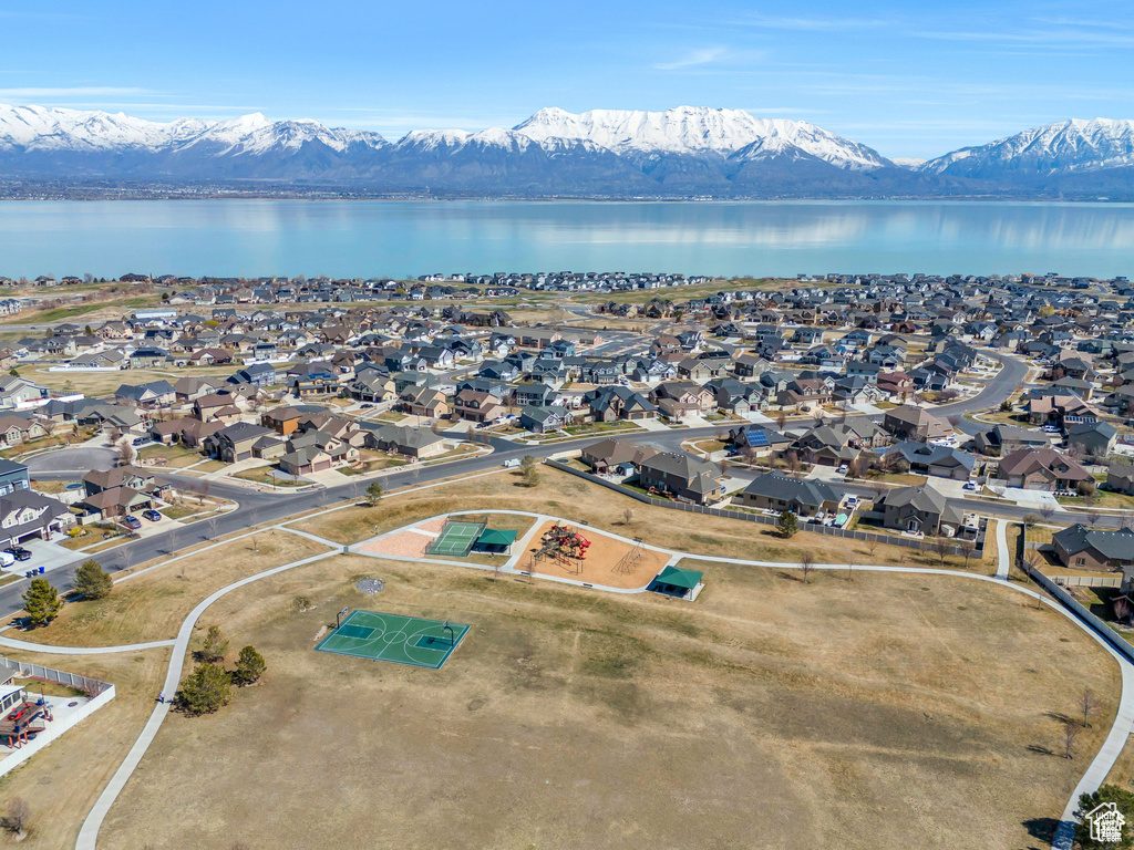 Aerial view of residential area featuring a water and mountain view