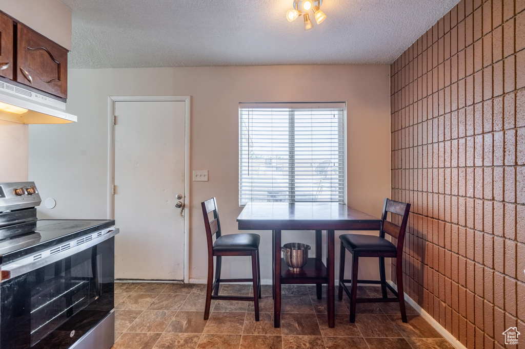 Dining area with a textured ceiling