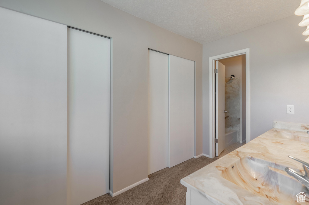 Bathroom with vanity and washtub / shower combination