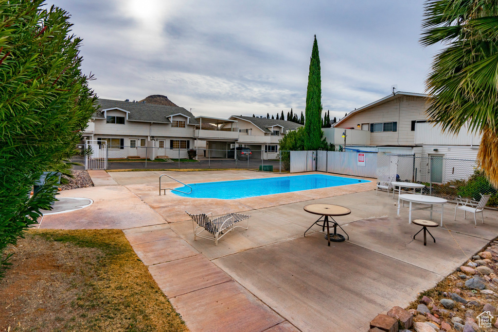 Community pool with a patio area