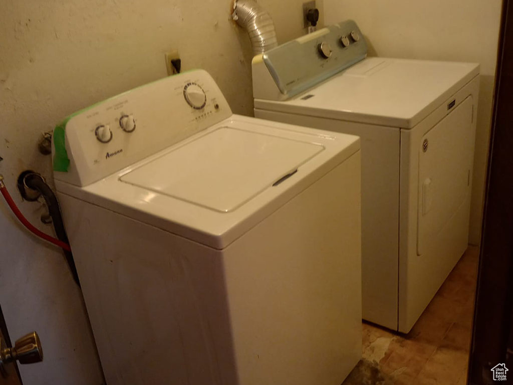 Laundry room with washing machine and clothes dryer