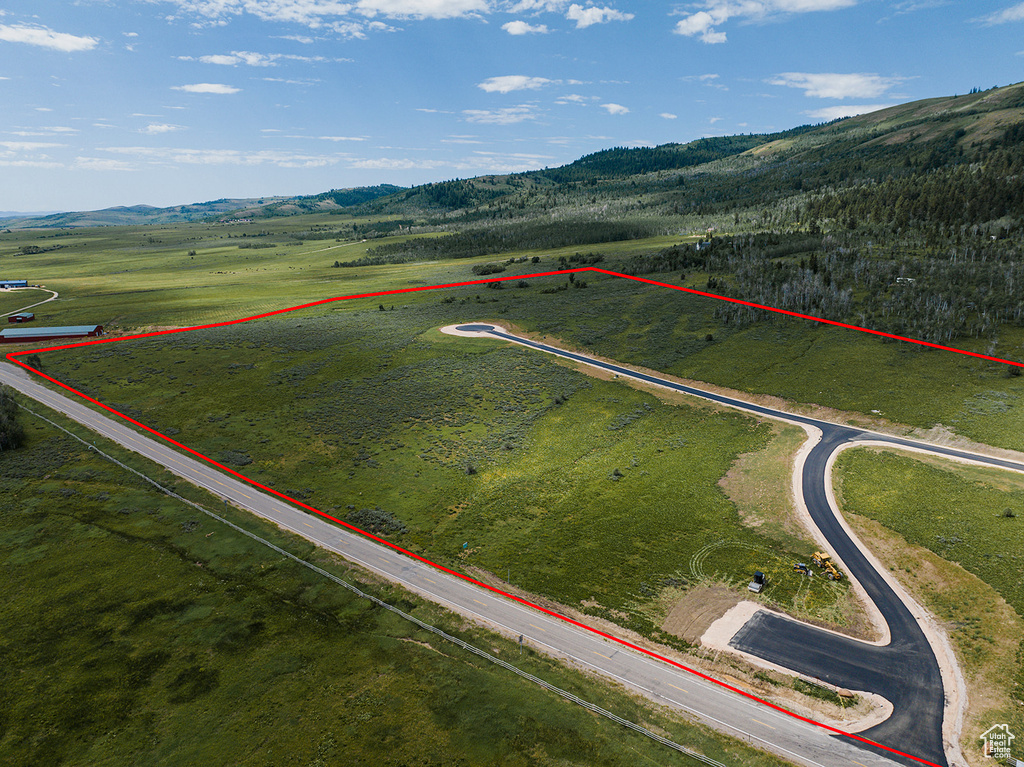 View of property location with property boundaries highlighted and a mountainous background