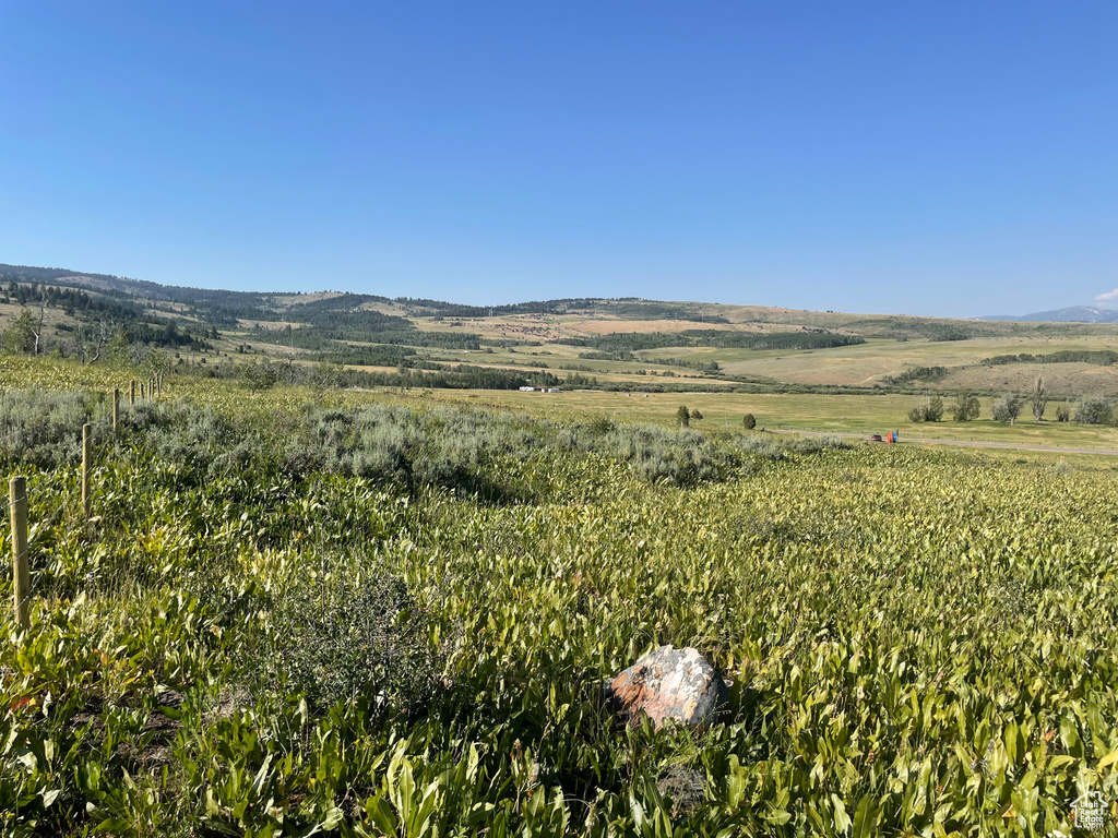 View of mountain backdrop featuring rural landscape