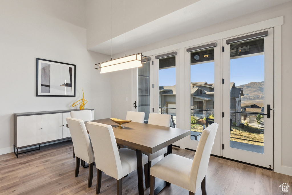 Dining area featuring light wood-type flooring and a mountain view