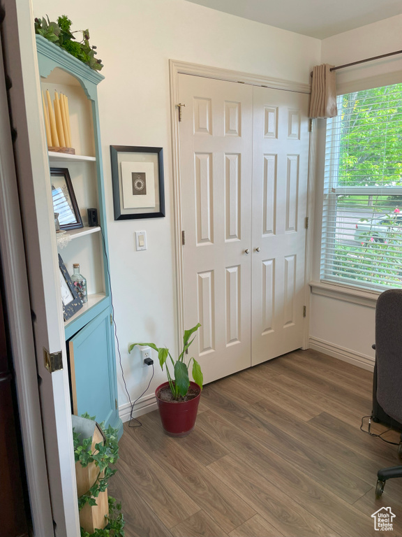 Office featuring wood finished floors, baseboards, and plenty of natural light