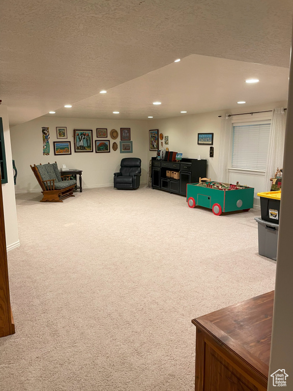 Playroom featuring recessed lighting, carpet floors, and a textured ceiling