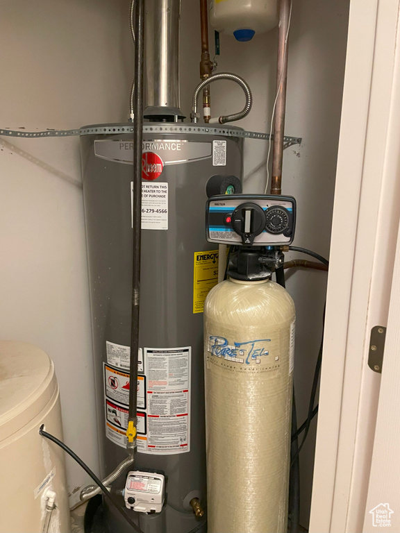 Utility room featuring water heater