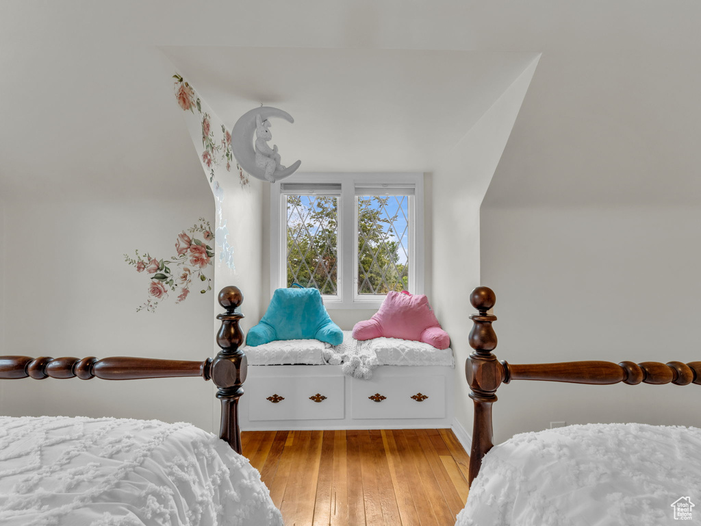 Bedroom featuring light wood-type flooring and baseboards