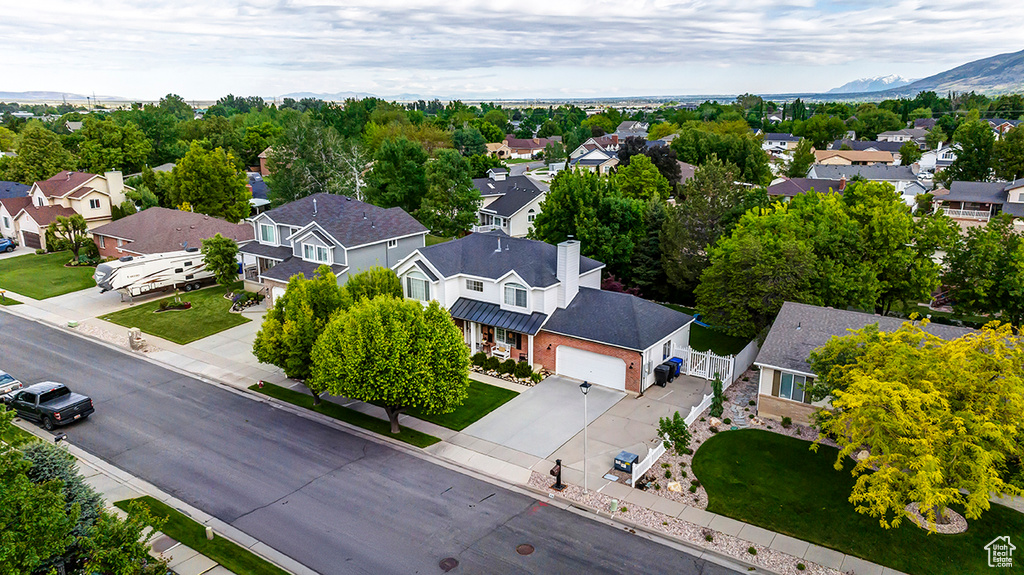 Aerial perspective of suburban area featuring a mountain backdrop