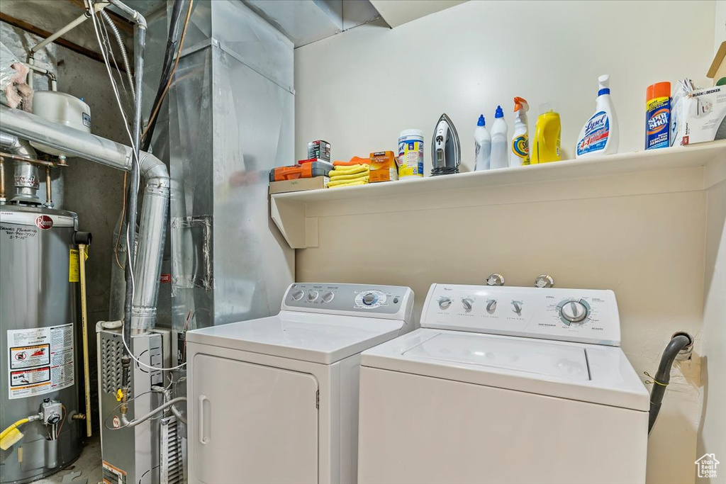 Clothes washing area with washer and dryer and gas water heater