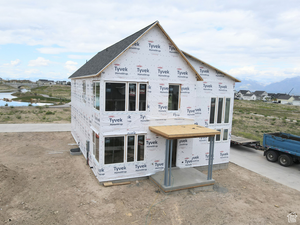 Rear view of house featuring a water view
