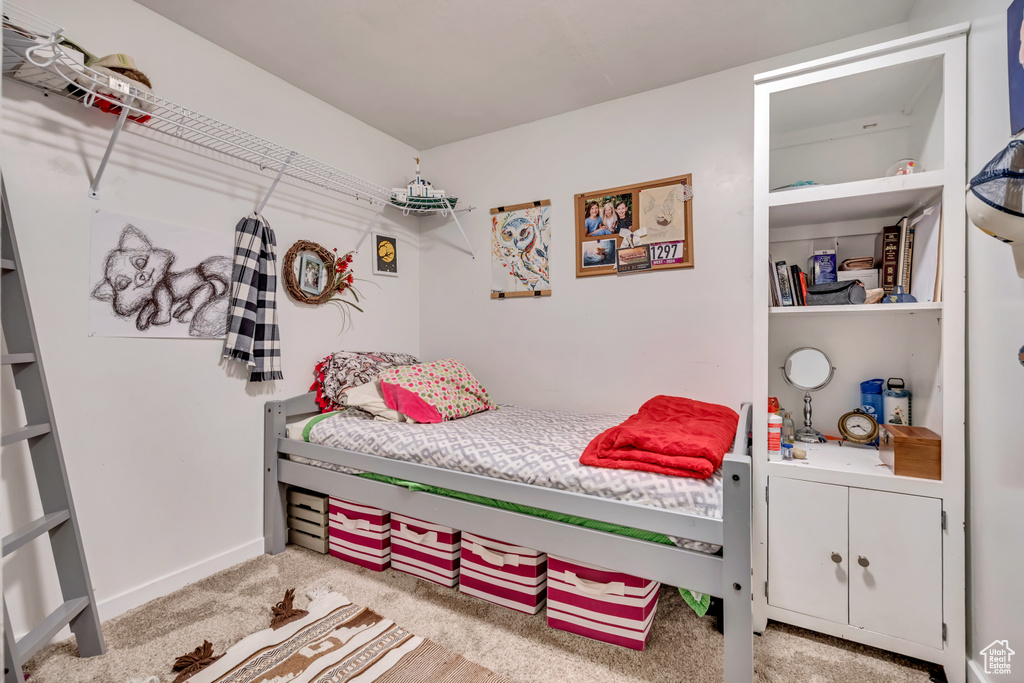 Carpeted bedroom with baseboards