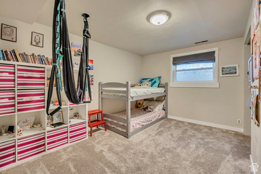 Bedroom with carpet and baseboards
